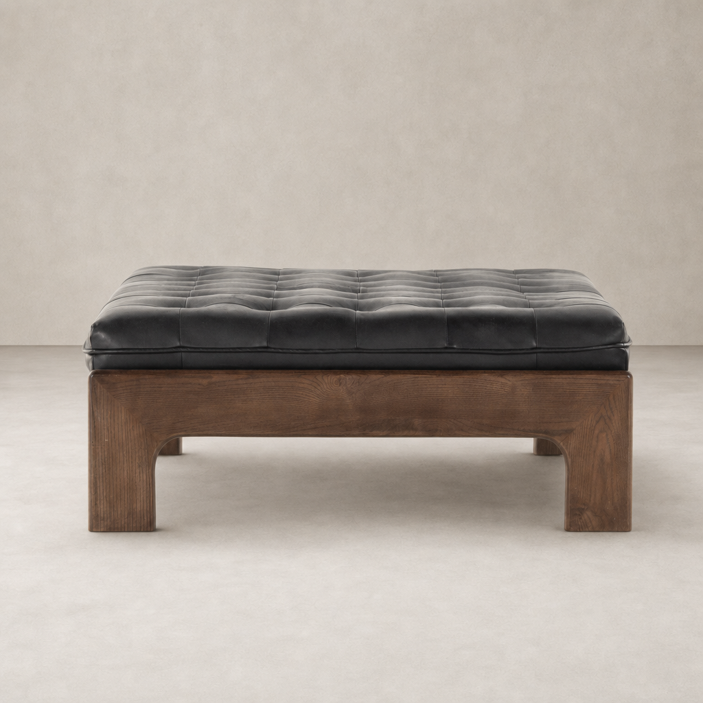 Hudson Cocktail Ottoman in Heirloom Black with tufted upholstery and sturdy wood base.