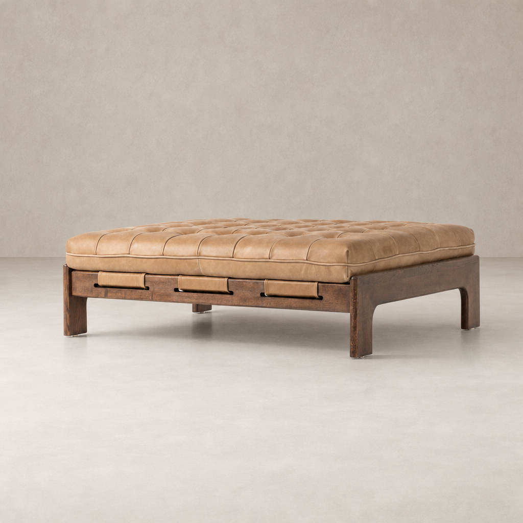 Hudson Cocktail Ottoman in Palermo Drift with tufted leather and wooden base.