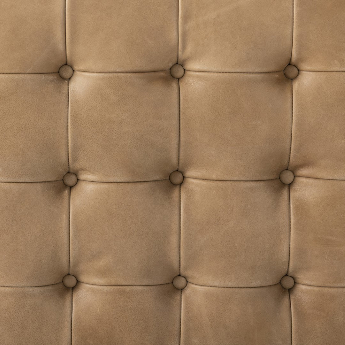Hudson Cocktail Ottoman in Palermo Drift featuring soft, tufted leather texture.