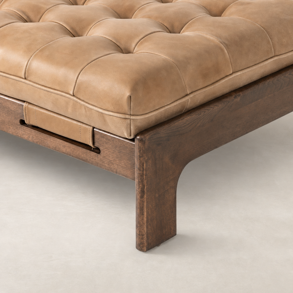 Hudson Cocktail Ottoman in Palermo Drift with tufted leather and wooden frame.