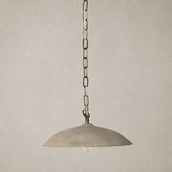 Light sand porcelain ceramic pendant light with an elegant, curved design.