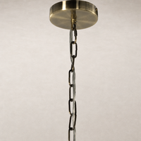 Ceramic pendant light in light sand porcelain with a decorative chain.