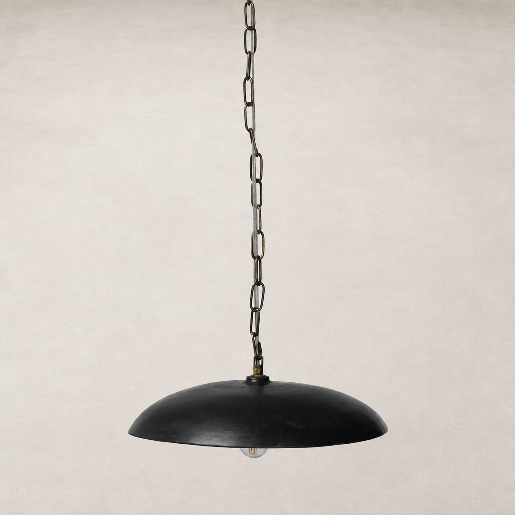 Aged black terracotta ceramic pendant with a sleek dome shape and chain link.