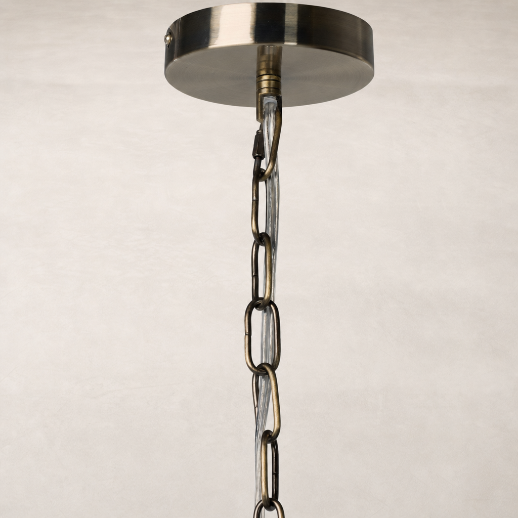 Ceramic pendant in aged black terracotta with a decorative chain detail.