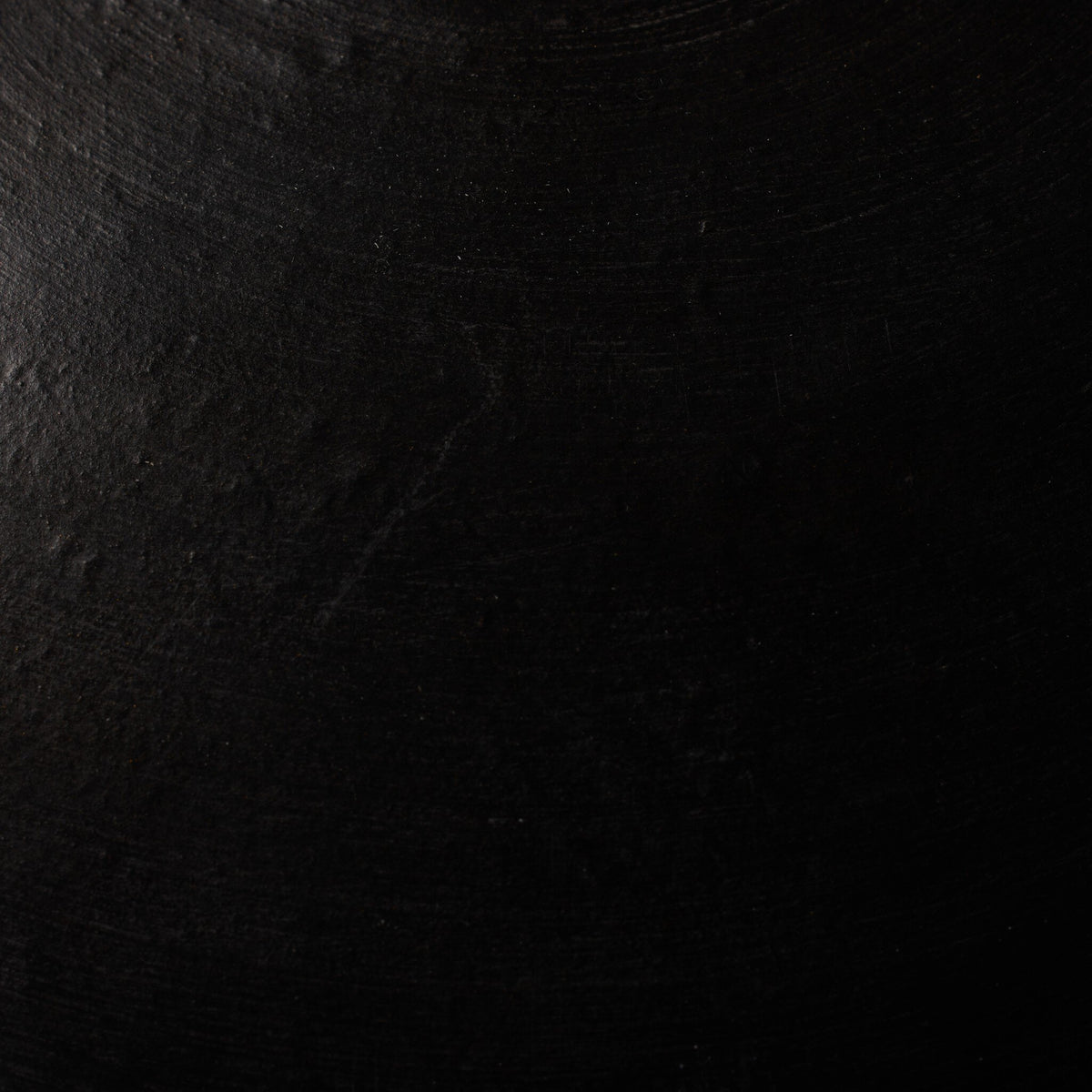Aged black terracotta ceramic pendant with a textured matte finish.
