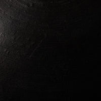 Aged black terracotta ceramic pendant with a textured matte finish.