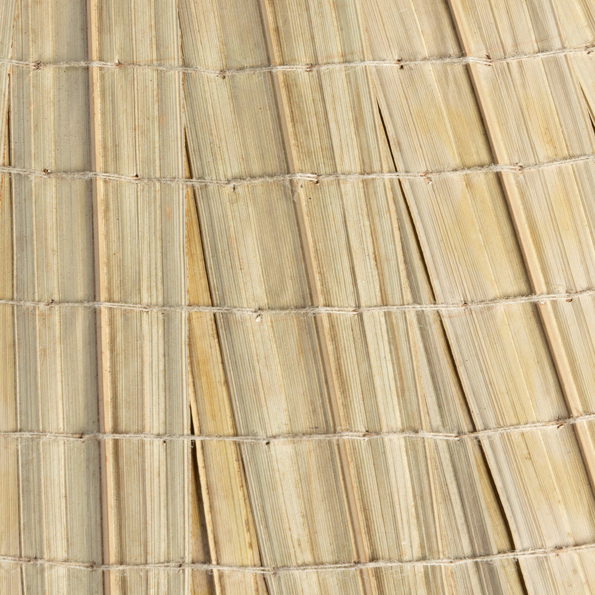 Sand porcelain table lamp featuring a textured, woven shade design.