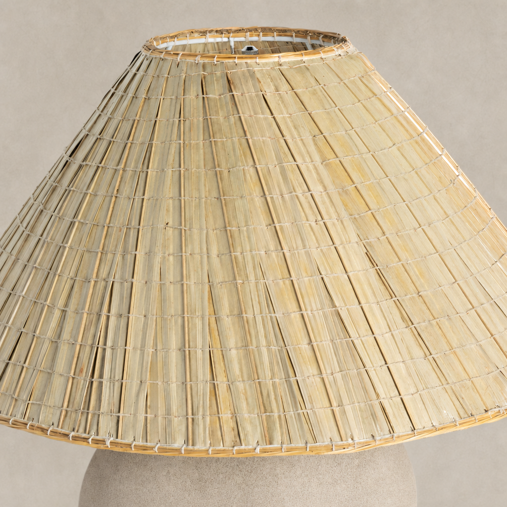 Sand porcelain table lamp with a textured woven shade design.