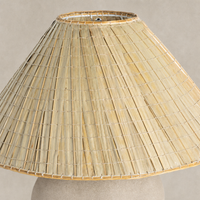 Sand porcelain table lamp with a textured woven shade design.