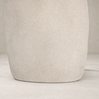 Sand porcelain table lamp with a smooth, rounded base and minimalist design.