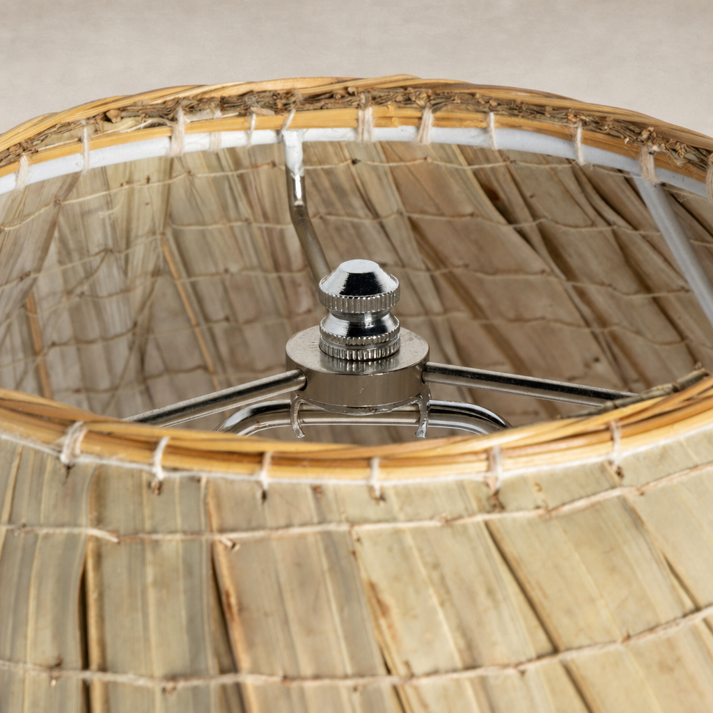 Sand porcelain table lamp featuring a woven texture and polished chrome fixture.