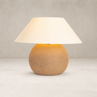 Dark sand porcelain ceramic table lamp with a soft white shade.