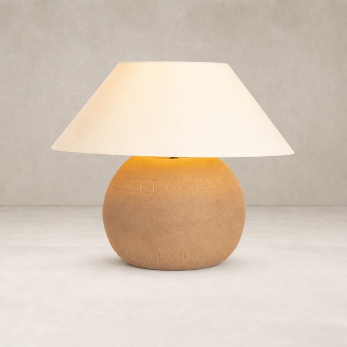 Dark sand porcelain ceramic table lamp with a soft white shade.