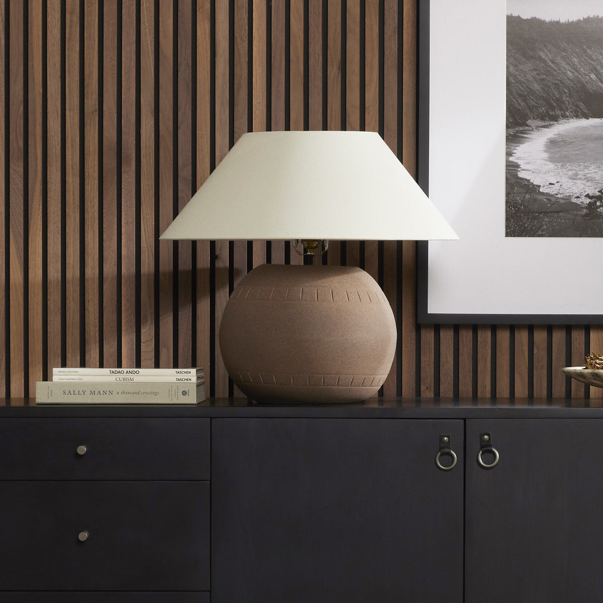 Dark sand porcelain ceramic table lamp with a simple ivory shade.