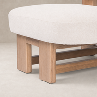 Isla Chair in Piermont Oyster with a soft, rounded seat and wooden base.