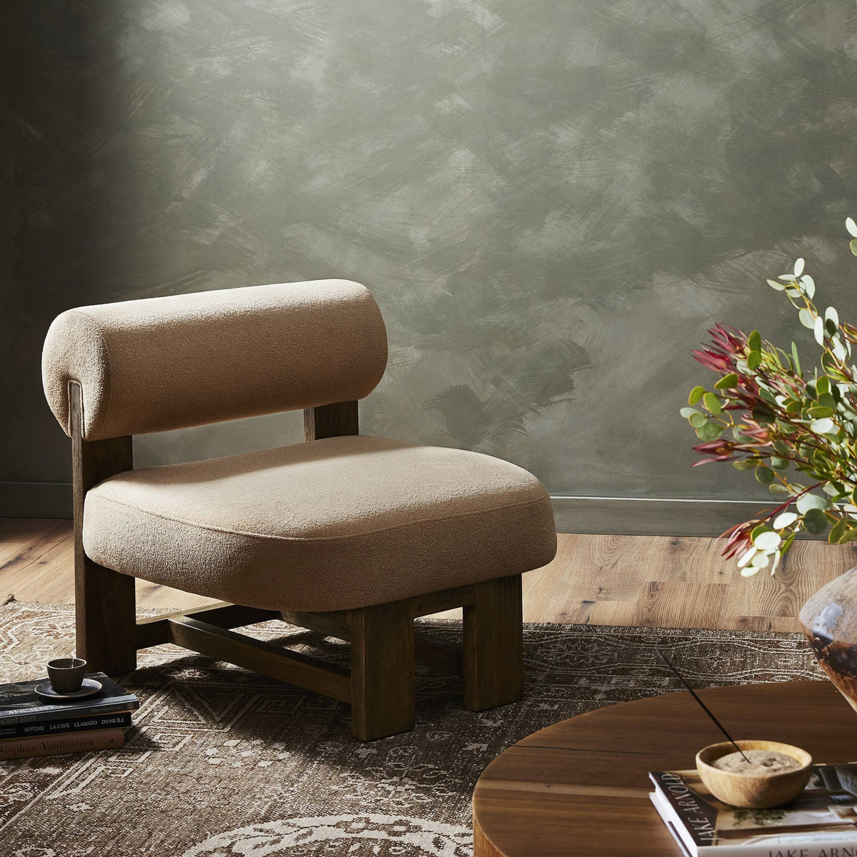 Isla Chair in Piermont Sand featuring a plush, rounded backrest and sturdy wooden legs.