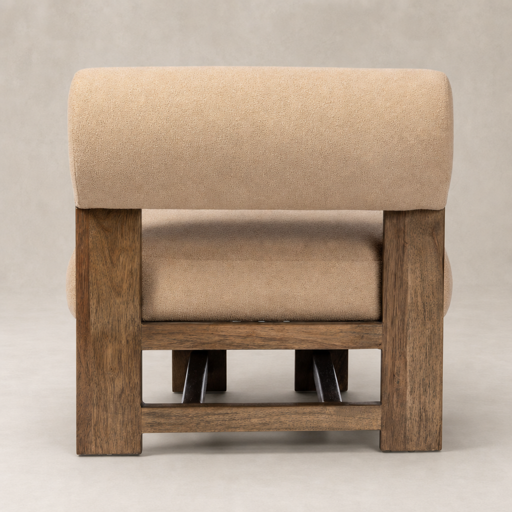 Isla Chair in Piermont Sand features a plush rounded back and sturdy wooden base.