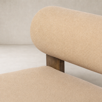 Isla Chair in Piermont Sand featuring soft, textured upholstery and a subtle round silhouette.