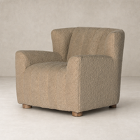 Baldwin Chair in Sheepskin Camel with textured finish and wooden legs.