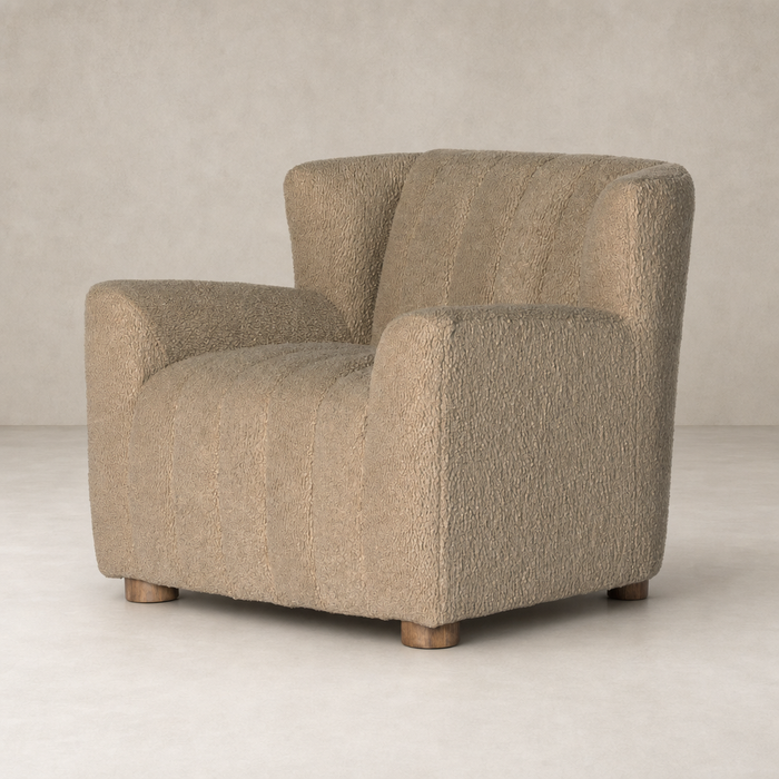 Baldwin Chair in Sheepskin Camel with textured finish and wooden legs.