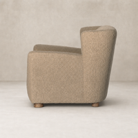 Baldwin Chair in sheepskin camel with a unique curved silhouette and textured finish.