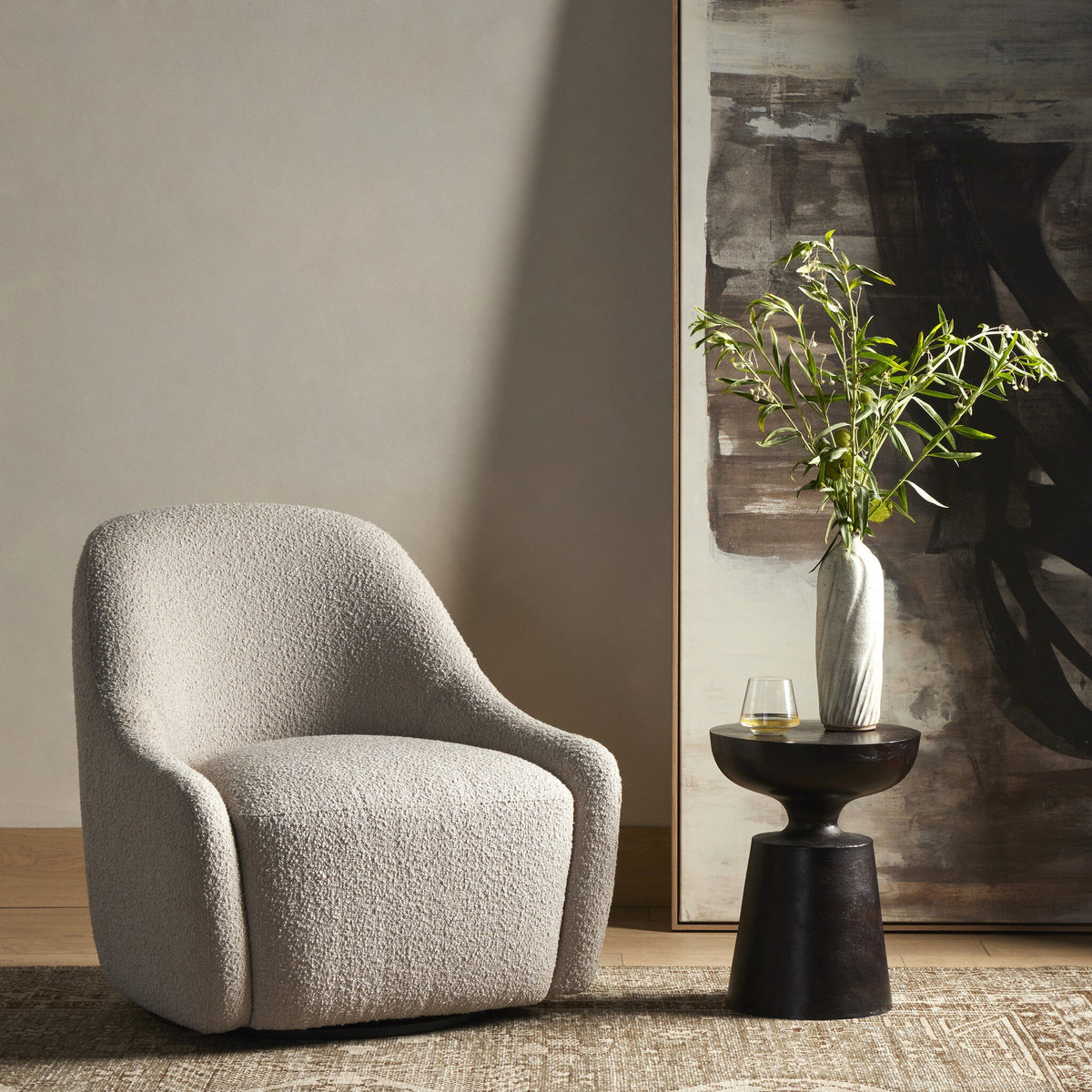 Rose Swivel Chair in Knoll Sand, featuring a cozy, curved design in a stylish living room.