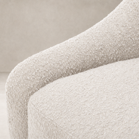 Close-up of the cozy Knoll Sand fabric on the Rose Swivel Chair.