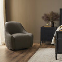 Rose Swivel Chair in Knoll Clay with a soft, textured finish in a cozy room setting.