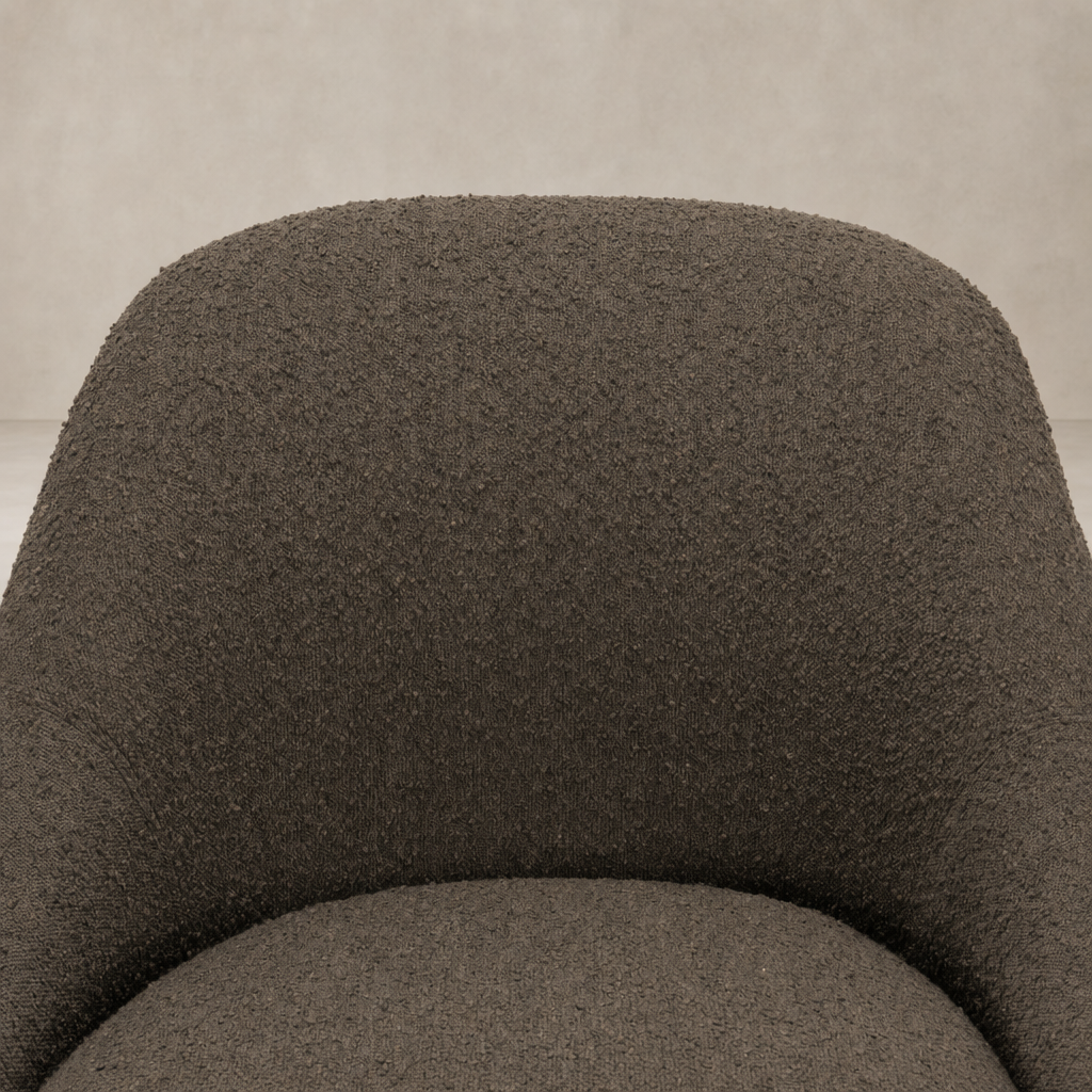 Rose Swivel Chair in Knoll Clay, featuring a textured, cozy upholstered surface.