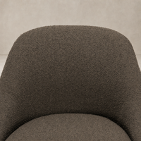 Rose Swivel Chair in Knoll Clay, featuring a textured, cozy upholstered surface.