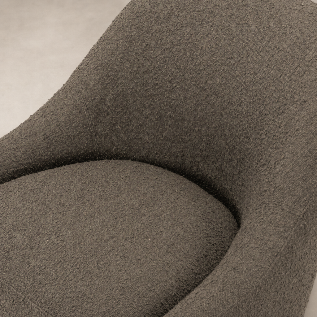Textured Knoll Clay upholstery of the Rose Swivel Chair, showcasing its modern design.