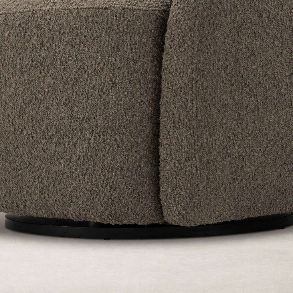 Close-up of the Rose Swivel Chair in Knoll Clay, showcasing its textured fabric and curved design.