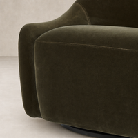 Rose Swivel Chair in Surrey Olive with soft, curved upholstery and sleek swivel base.