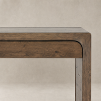 Rustic grey Zinnia Desk with smooth finish and rounded edges, showcasing natural wood grain.