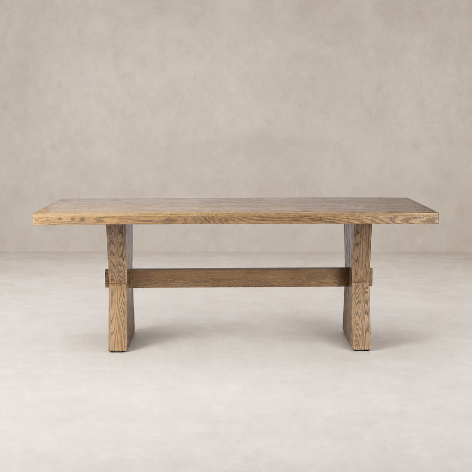Pelton Dining Table in drifted oak showcasing a sleek, modern design with sturdy legs.