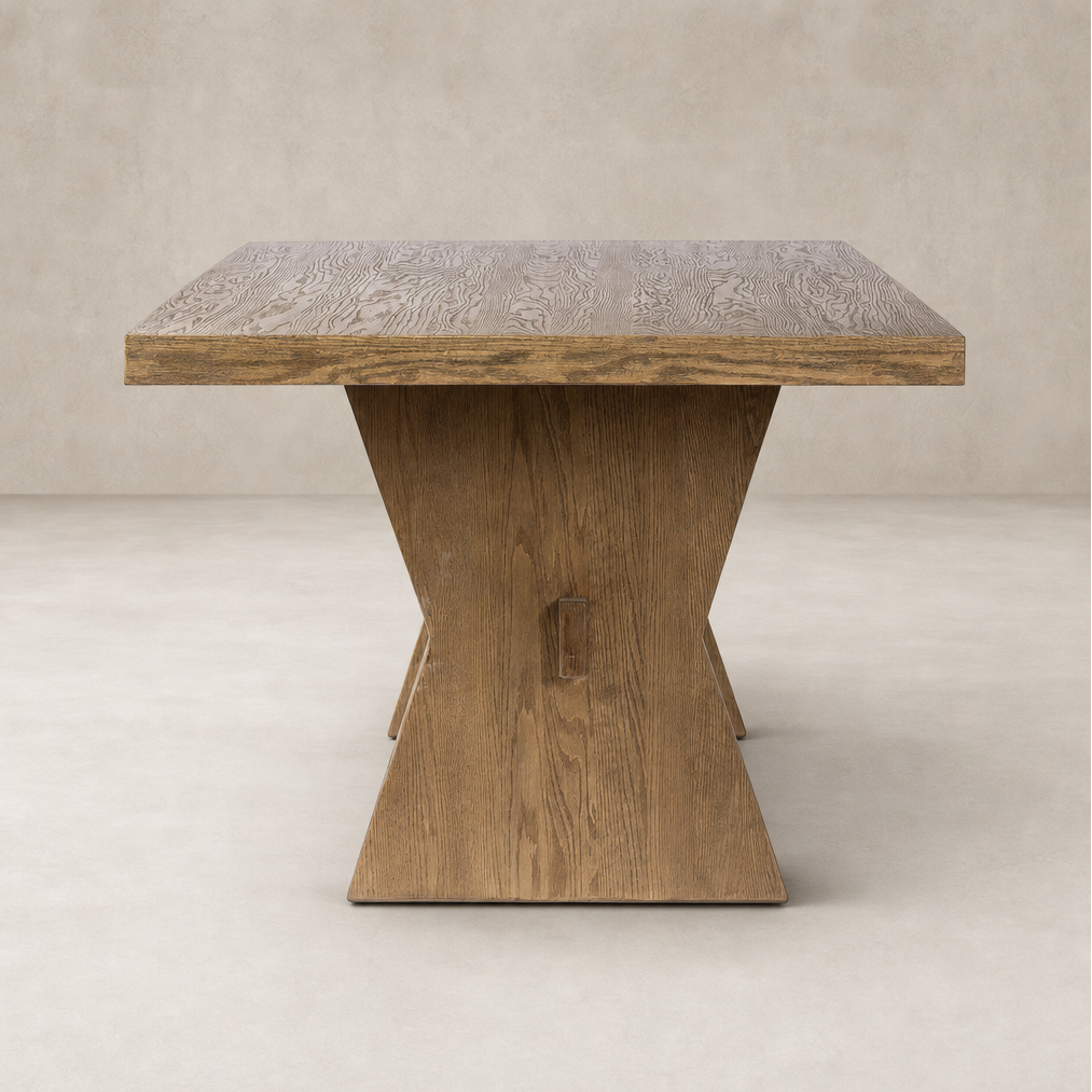 Pelton Dining Table in drifted oak featuring a stylish, geometric base and textured surface.