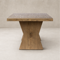 Pelton Dining Table in drifted oak featuring a stylish, geometric base and textured surface.