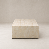 Bram Coffee Table in faux travertine features a sleek, rectangular design with textured surface.