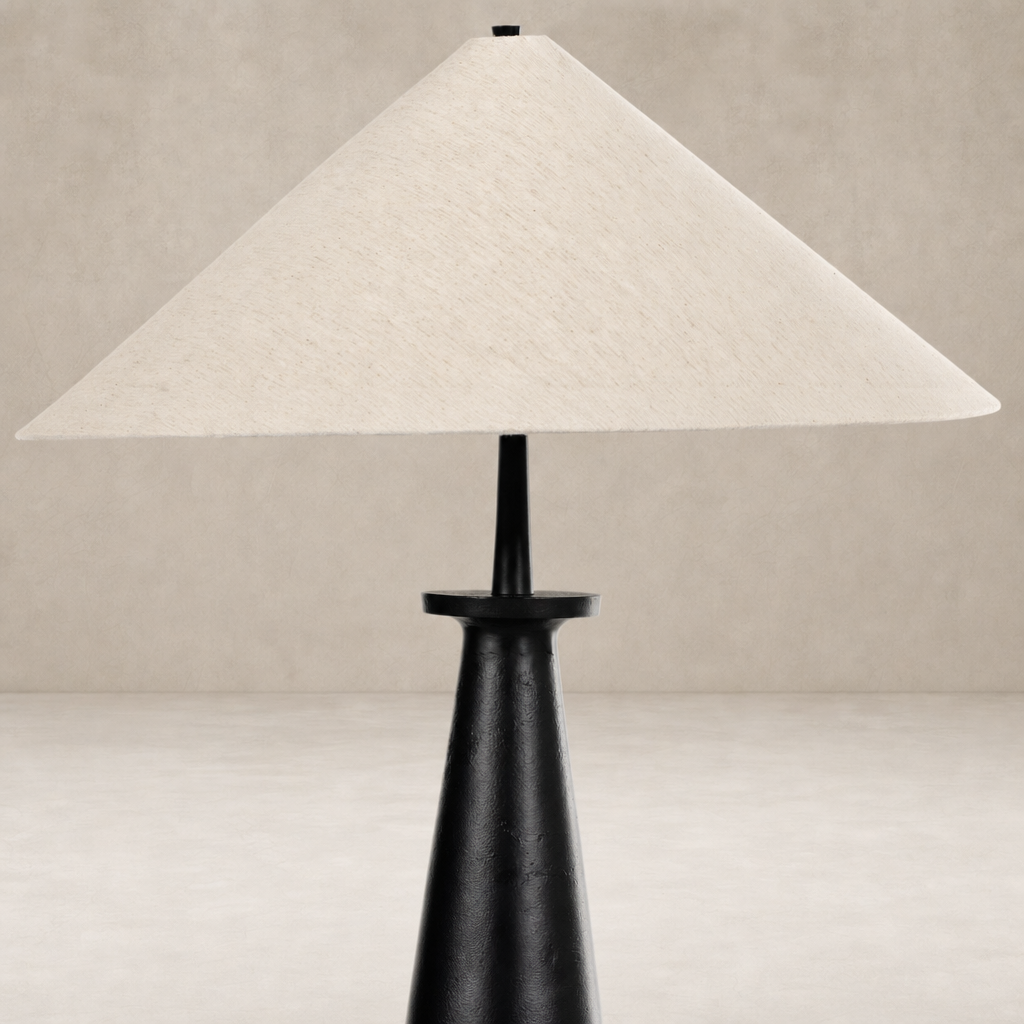 Matte black cast aluminum tapered shade floor lamp with a sleek, modern design.