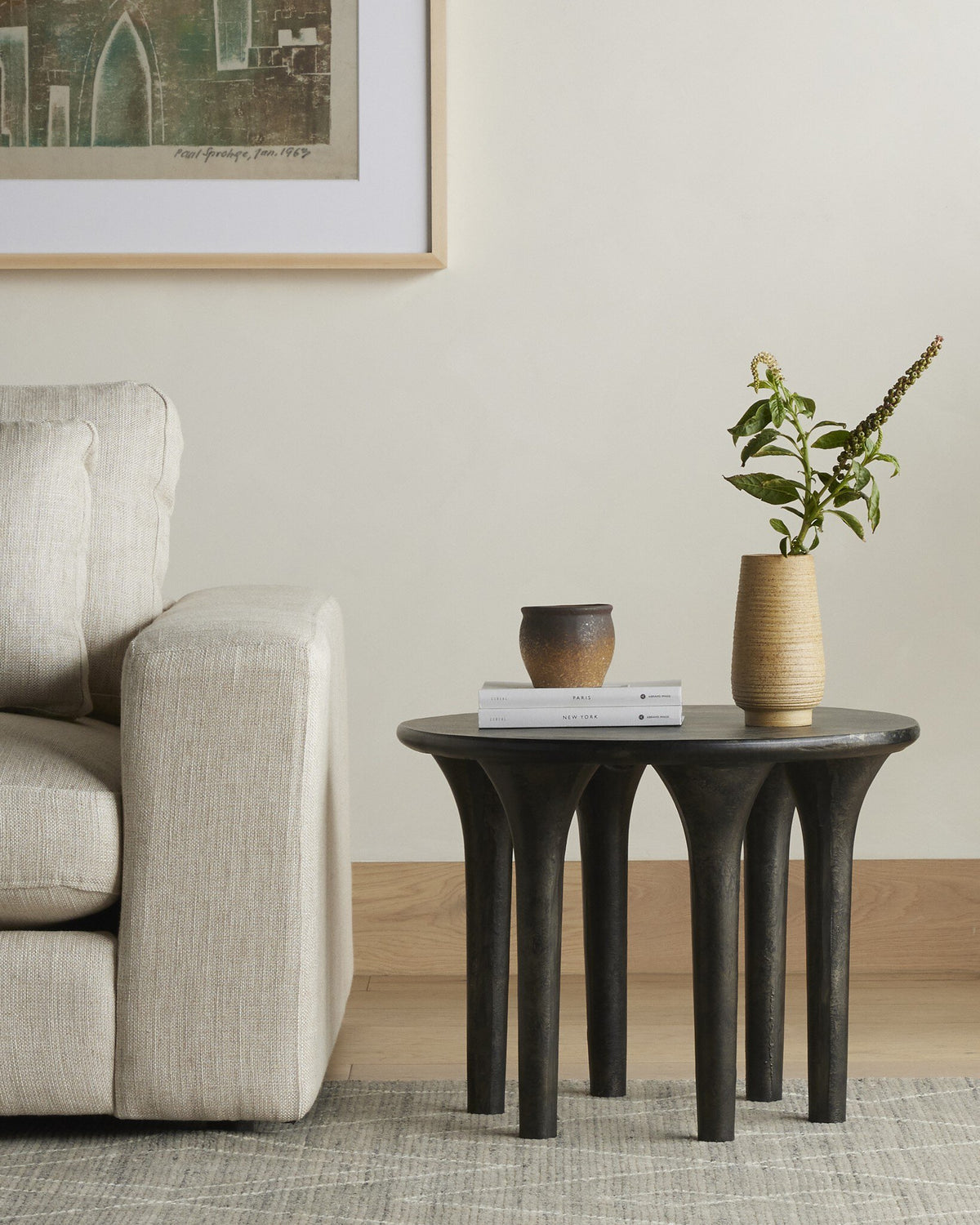 Holden End Table with unique sculptural legs, styled in a cozy living room.