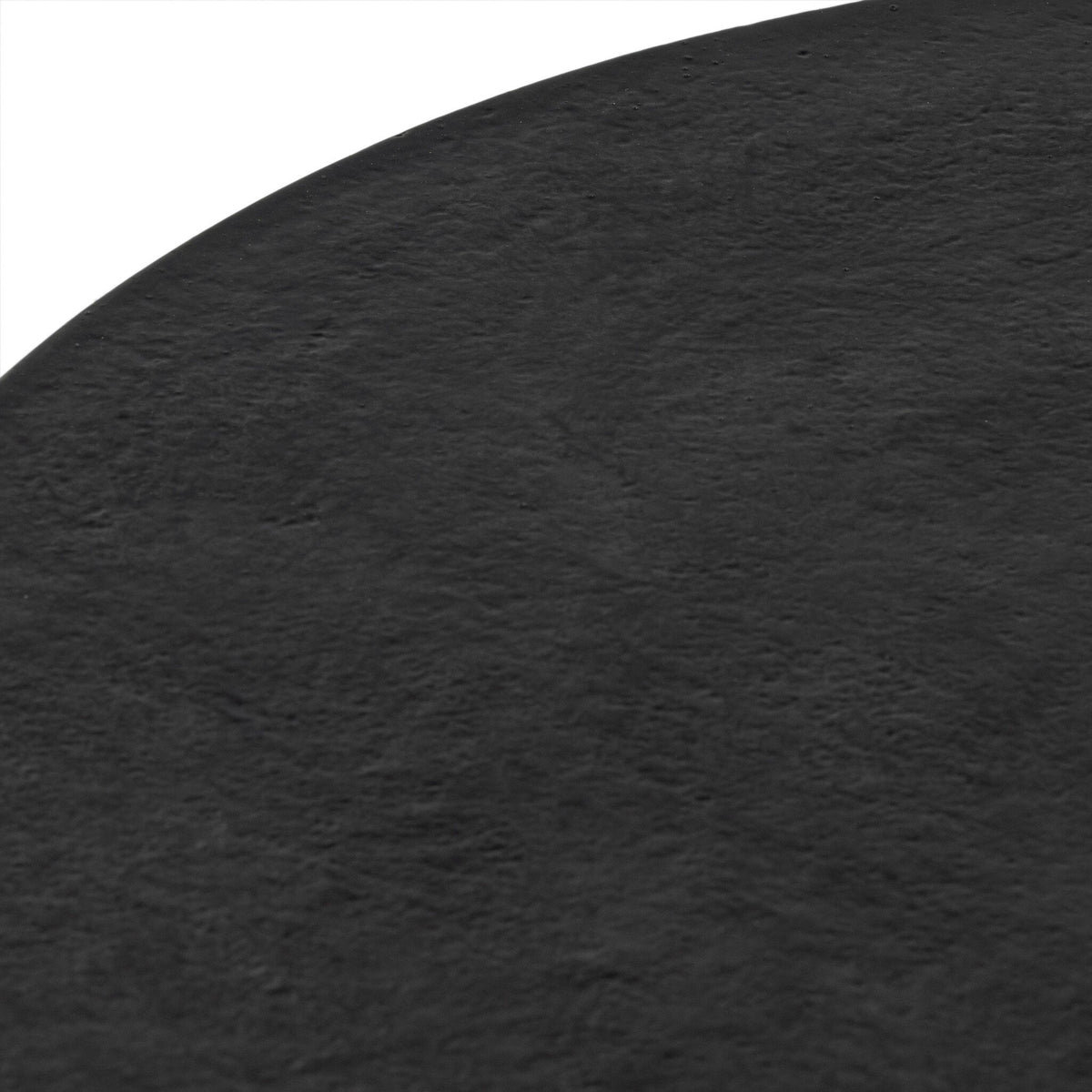 Close-up of the Holden End Table's textured black finish highlighting its sleek surface.