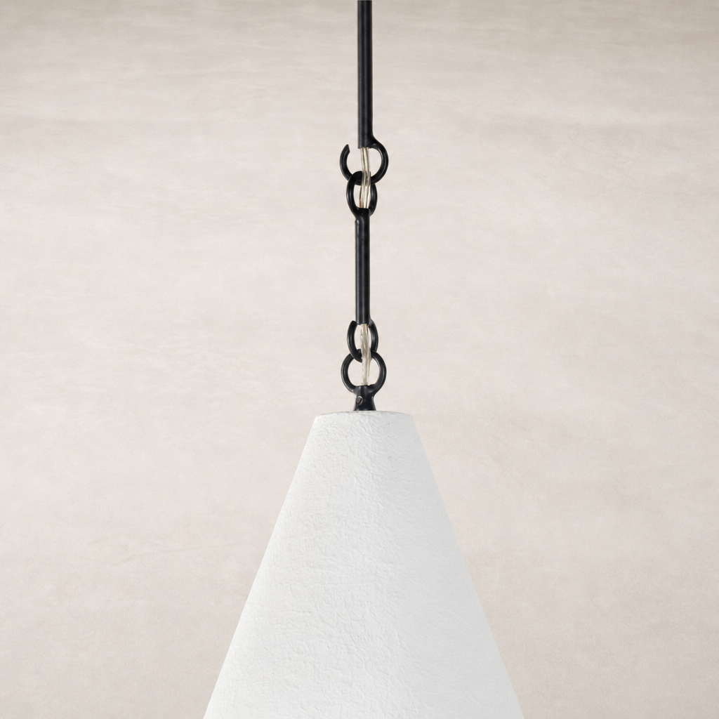 Matte white plaster pendant with textured surface and black hanging chain.