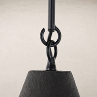 Matte black plaster pendant light showcasing a distinctive bell shape and textured finish.