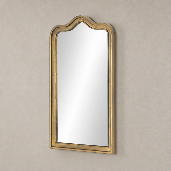 Etta Mirror in raw antique brass iron with an elegant arched top design.