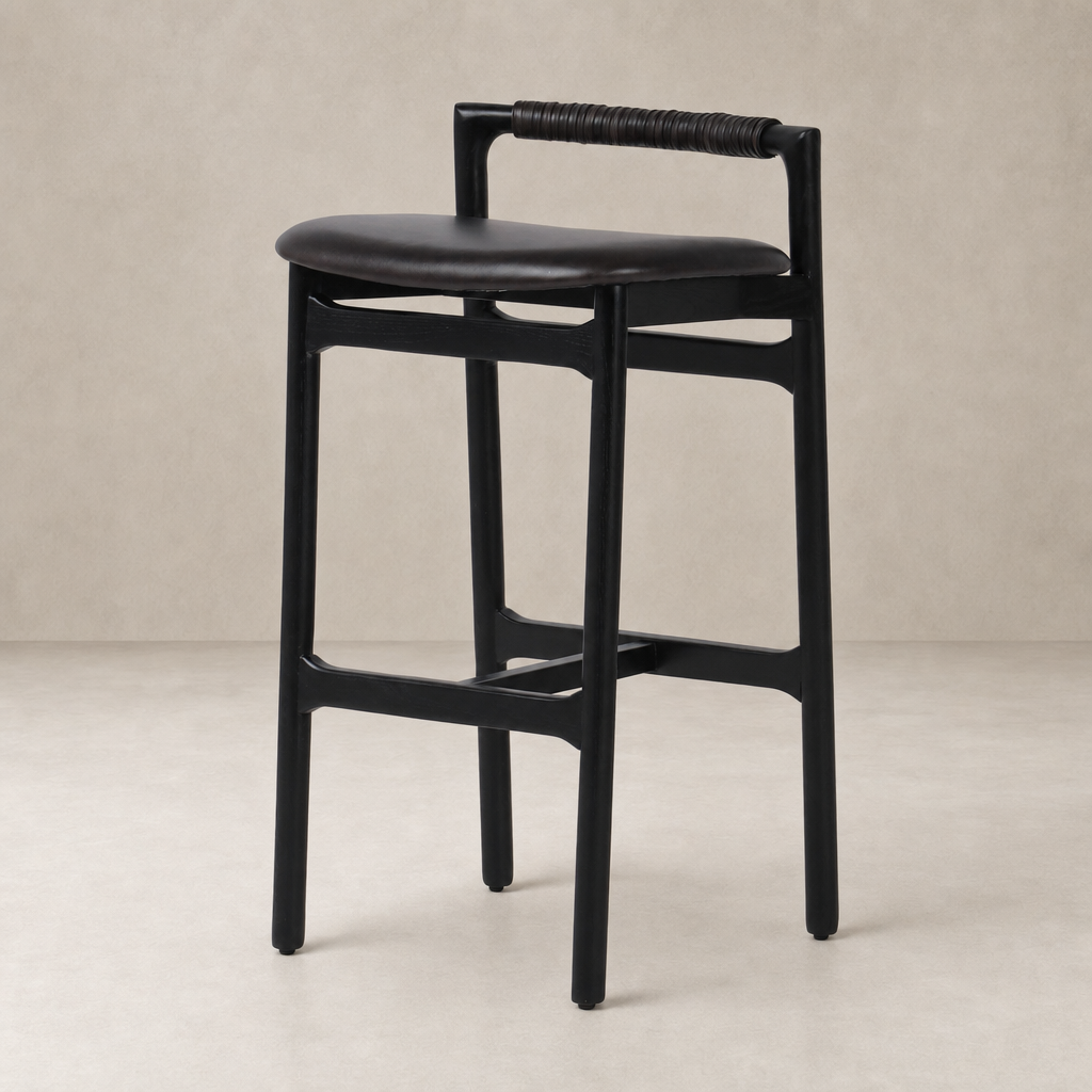 Nadia Bar + Counter Stool in Sonoma Black with a sleek, minimalist design and woven handle.