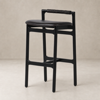 Nadia Bar + Counter Stool in Sonoma Black with a sleek, minimalist design and woven handle.