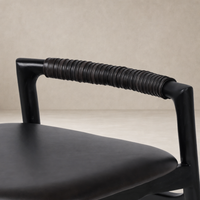 Close-up of the Nadia Bar + Counter Stool's Sonoma Black handle with ribbed texture.