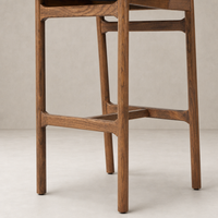 Nadia Bar + Counter Stool in Haven Tobacco showcasing elegant wooden legs and sleek design.