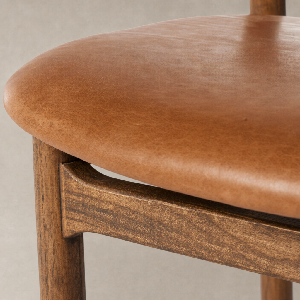 Close-up of the Nadia Bar + Counter Stool in Haven Tobacco featuring a smooth, curved seat.