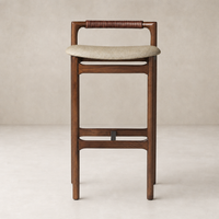 Nadia Bar + Counter Stool in Alcala Wheat with a sleek, curved seat and wooden frame.